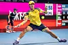 Kwon Soon-woo lunges for the ball against Mackenzie McDonald of the United States during their men's singles round of 16 match at the Japan Open in Tokyo on Wednesday. [AFP/YONHAP]