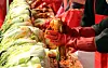 Volunteers make kimchi during a charity event for the elderly at a festival in Cheongju, North Chungcheong on Nov.1. [YONHAP]