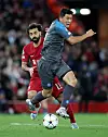 Napoli's Kim Min-jae, right, vies for the ball with Liverpool's Mohamed Salah during a UEFA Champions League Group A match at Anfield in Liverpool, England on Tuesday. [REUTERS/YONHAP]