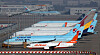 Korean Air and Asiana planes parked at Incheon International Airport on Monday. Korean Air will be acquiring Asiana with help from KDB. [YONHAP]