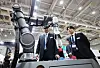 Visitors inspect an electronics manufacturing device displayed at the Smart SMT&PCB Assembly trade show held at Suwon Convention Center in Suwon, Gyeonggi, on Wednesday. [YONHAP]