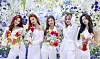 Members of K-pop girl band ITZY hold flower-decorated letter panels, which together make the word “MIDZY,” during an online concert, 'Fan Party Live,' on Saturday afternoon. “MIDZY” is the name of ITZY’s official fan club and the group’s new song for the fans, which the band unveiled during the concert. [JYP ENTERTAINMENT]