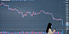 A graph shows the value of Bitcoin plummeting below 30 million won ($24,000) at the cryptocurrency exchange Bithumb customer center in Seocho-dong, southern Seoul, on Tuesday. Rising inflation and the central banks’ interest rate hikes are landing heavy blows on the financial markets. [YONHAP]