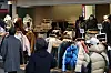 Shoppers pass by racks of coats and jackets in the Myeong-dong shopping district in central Seoul on Sunday. [YONHAP]