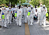 Business owners in Itaewon-dong, central Seoul, spray disinfectant on the streets of Itaewon Wednesday as a cluster of infections linked to the area’s nightclubs and bars continues to swell. [NEWS1]