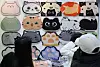 Cat enthusiasts browse a range of products on display at the Nyang Nyang Punch Cat Show at Coex Magok in Gangseo District, western Seoul, on Jan. 26. [YONHAP]