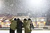 Passersby capture the season’s first snowfall at Hwaseong Haenggung Square in Suwon, Gyeonggi, on Dec. 4. [YONHAP]