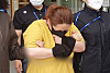 A 43-year stepmother, charged in the death of her nine-year-old stepson after allegedly locking him in a suitcase for seven hours, walks out of the Cheonan Dongnam Police Precinct after being questioned by investigators on Wednesday.  [NEWS1]
