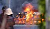 A fire engulfs a building in Nangok-dong in Gangeung, Gangwon, on Tuesday morning. Some 100 buildings burned to the ground due to the massive fire. [YONHAP]