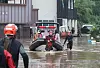 Firefighters evacuate people in Yongchon-dong, Seo District, Daejeon, after overnight rain flooded the area on Wednesday. [NEWS1]