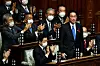 Fumio Kishida, standing, receives applause after he is elected as Japan’s new prime minister at the lower house of the Diet in Tokyo Friday. Korean President Moon Jae-in sent a congratulatory letter to Kishida the same day. [AFP/YONHAP]