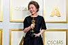 Actor Youn Yuh-jung poses for a photo with her Oscar trophy at the 93rd Academy Awards held in Los Angeles on April 25. [REUTERS/YONHAP]