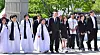 President Yoon Suk Yeol, center, attends a ceremony marking the 44th anniversary of the Gwangju Democratization Movement at the May 18th National Cemetery in Gwangju on Saturday, alongside students and families of victims. He attended the ceremony marking the 1980 pro-democracy uprising in Gwangju for the third consecutive year. [JOINT PRESS CORPS]