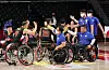 Members of the Korean wheelchair basketball team are consoled by team staff after their defeat against Spain on Wednesday evening. [REUTERS/YONHAP]