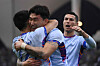 Riyadh XI defender Jang Hyun-soo, center, celebrates with Cristiano Ronaldo, right, after scoring his team's third goal during an exhibition match against Paris Saint-Germain at the King Fahd Stadium in Riyadh on Friday.  [AFP/YONHAP]