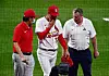 St. Louis Cardinals starting pitcher Kim Kwang-hyun walks off the field with a trainer prior to the start of the fourth inning against the Cincinnati Reds at Busch Stadium on Friday. [USA TODAY/YONHAP]