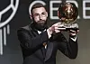 Real Madrid's Karim Benzema poses with the Ballon d'Or in Paris on Monday. [REUTERS/YONHAP]