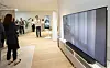 A Samsung Electronics employee gives a briefing to Korean press on Tuesday at its Customer Experience Innovation Lab in Suwon, Gyeonggi. [SAMSUNG ELECTRONICS]