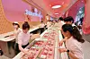 Staff at the Baskin Robbins' Cheongdam branch check out the ice cream flavors on May 15 [NEWS1]