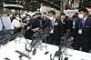 Defense Minister Suh Wook, center, looks at guns on display at the Defense & Security Expo Korea 2020, held at the Kintex Convention Center in Goyang, Gyeonggi, on Wednesday. [YONHAP]