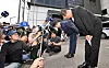 Park Soon-kwan, CEO of Aricell, (right) and other company figures bow their heads at the accident site on Tuesday as they issue a public apology following the massive factory fire that killed 23 workers on Monday. [YONHAP]