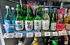 Bottles of soju are displayed at a convenience store in Seoul. Major convenience store chains including CU, GS25, 7-Eleven and Emart24 lowered their prices for the liquor by 200 to 300 won on Tuesday. [NEWS1]