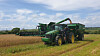 A combine is used to harvest oats on a farm in Russia. [LOTTE TRADING]