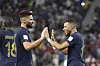 Oliver Giroud, left, celebrates with Kylian Mbappe during a round of 16 match between France and Poland at the 2022 FIFA World Cup at Al Thumama Stadium in Doha, Qatar on Sunday. [XINHUA/YONHAP]