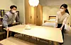 Hyundai Livart workers deliver a table. [HYUNDAI LIVART]