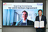 SK geo centric CEO Na Kyung-soo poses for a photo with Loop Industries CEO Daniel Solomita after they signed an agreement to build a plastic recycling plant in Ulsan. [SK GEO CENTRIC]