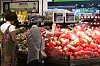 Customers shop for apples at a large supermarket in Seoul on Tuesday. [YONHAP NEWS]
