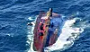 Coast Guard members search a capsized fishing boat on Saturday. A 20-ton vessel was discovered capsized south of Tongyeong, South Gyeongsang, 6:43 a.m. Saturday. [COAST GUARD]