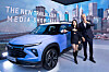 GM Korea President Roberto Rempel, right, and dancer Honey J pose with the latest Chevy Trailblazer at a press event Wednesday in southern Seoul. Honey J is a global ambassador of the Trailblazer SUV. [GM KOREA]