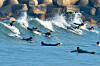Surfers ride waves off Pohang, North Gyeongsang, on Tuesday, as daytime temperatures hover around 19 degrees Celsius (66.2 degrees Fahrenheit). [NEWS1]
