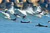 Surfers ride waves off Pohang, North Gyeongsang, on Tuesday, as daytime temperatures hover around 19 degrees Celsius (66.2 degrees Fahrenheit). [NEWS1]