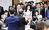 President Yoon Suk Yeol and first lady Kim Keon-hee greet Koreans living in Tokyo during a luncheon meeting Thursday. [JOINT PRESS CORPS]