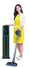 A model stands beside LG Electronics' All-in-One Tower for its cordless vacuum cleaners. [LG ELECTRONICS]