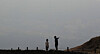 Two people look down on the city of Osan in Gyeonggi from Bojeok Temple as thick fine dust engulfs the area on Tuesday. [NEWS1]