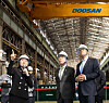 Romania's president visits a small module reactor production facility at Doosan Enebility's headquarters in Changwon, North Gyeongsang, with Doosan Enerbility's CEO last month. [YONHAP]