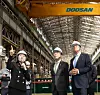 Romania's president visits a small module reactor production facility at Doosan Enebility's headquarters in Changwon, North Gyeongsang, with Doosan Enerbility's CEO last month. [YONHAP]