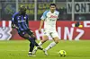 Inter Milan's Romelu Lukaku, left, kicks the ball by Napoli's Kim Min-jae during a Serie A match at the San Siro stadium in Milan, Italy on Wednesday. [AP/YONHAP]
