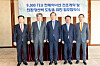 Officials, including Minister of Oceans and Fisheries Cho Seung-hwan, center, and CEO of HMM Kim Kyung-bae, second from right, pose for a picture at a signing ceremony for the container ship construction contract at the Westin Josun Hotel in central Seoul on Tuesday. [HMM]