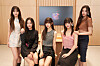 Girl group NewJeans pose for photos before an interview with the local press on March 29 at the newly-opening Apple Gangnam retail store in southern Seoul. [APPLE KOREA]