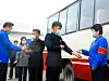 North Koreans in masks get temperature checks before boarding a bus in Pakchon County in North Pyongan, pictured in an article run by the state-run Rodong Sinmun on Covid-19 quarantine measures Tuesday. Pyongyang claims that it has no Covid-19 cases. [RODONG SINMUN]