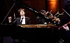 Yunchan Lim from Korea performs a Mozart Concerto with conductor Nicholas McGegan and the Fort Worth Symphony Orchestra in the Semifinal round in the Sixteenth Cliburn International Piano Competition in Bass Performance Hall in Fort Worth, Texas, on June 11. [RALPH LAUER]