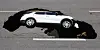 A Tivoli SUV is swallowed up by a sinkhole that appeared on a road in Seodaemun District, western Seoul on Thursday morning. [YONHAP]