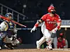 Choi Hyoung-woo of the Kia Tigers, in red, watches his three-run home run during a game against the NC Dinos at Changwon NC Park on Oct. 15. [YONHAP]