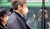 Passersby wear masks in the streets of Jongno District, central Seoul, on Thursday. [NEWS1]