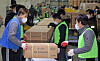 Workers load materials for the national college entrance exam, or College Scholastic Ability Test (CSAT), onto trucks to be shipped nationwide to schools where students will be taking the exam on Thursday. The exam, held only once a year, is a national phenomenon because the results from the test largely determine students' admissions to the country's top universities. [KIM SUNG-TAE]