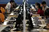 In this June 16, 2017, file photo, North Korean men and women use computer terminals at the Sci-Tech Complex in Pyongyang, [AP/YONHAP]